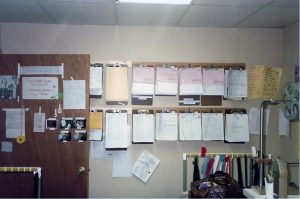 The paperwork wall of Kelly and Joe's editing room at Owensby Studio.