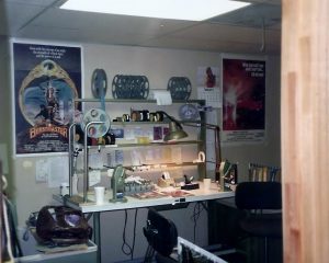 Through the doorway into Joe's editing room and his editing bench. Movie posters of "The Beastmaster" and "The Fog" which Joe worked on decorate the wall behind Joe's bench.