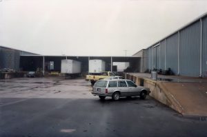 The Central Production area after filming wrapped at Owensby Studio. Semi-Trailers backed up to Production offices for loading. Editing's station wagon parked in FG.