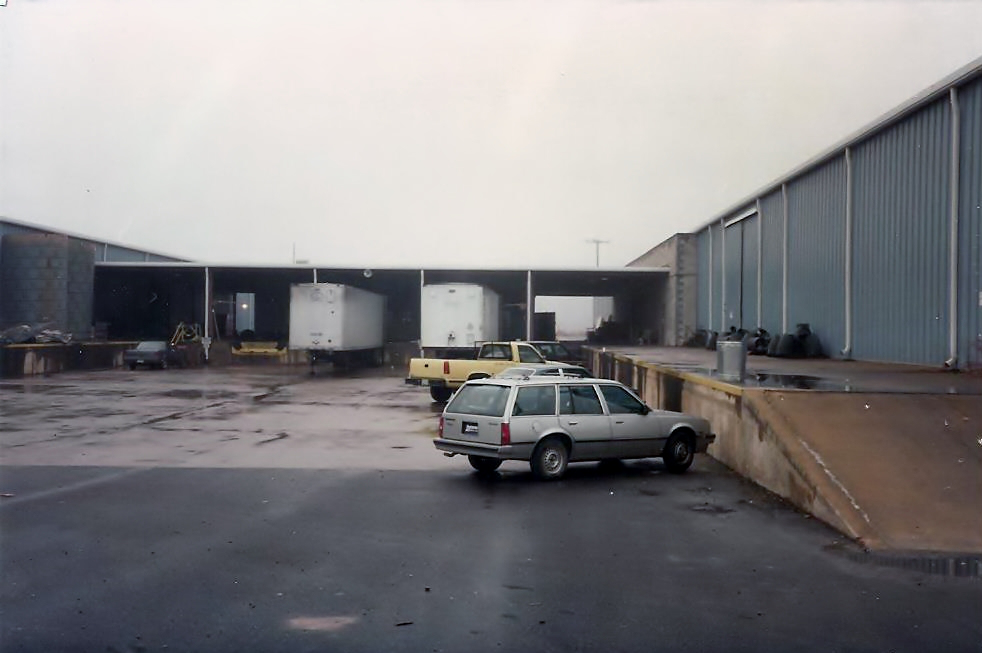 The Central Production area after filming wrapped at Owensby Studio. Semi-Trailers backed up to Production offices for loading. Editing's station wagon parked in FG.