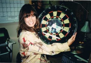 Gale with dartboard with Earl Owensby photo as the bullseye!