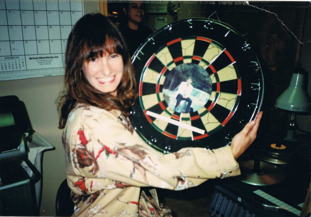 Gale with dartboard with Earl Owensby photo as the bullseye!